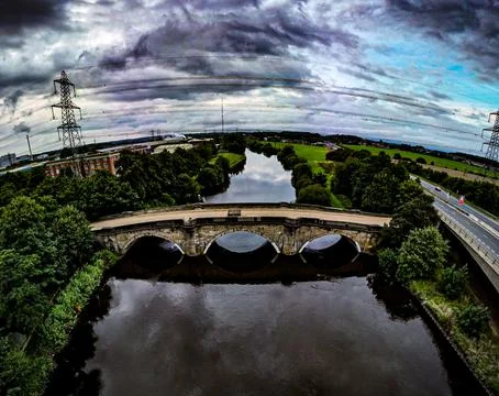 Dark clouds over old bridge at Ferrybridge Stock Photos