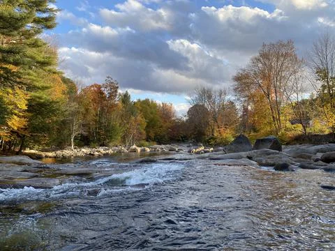 Dark Clouds over a River in Autumn Stock Photos