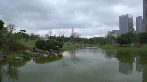 Dark clouds over Shenzhen Xiangmi Park Stock Footage 194017908