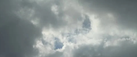 Dark clouds over the sky anamorphic 4K video Stock Footage 318975368