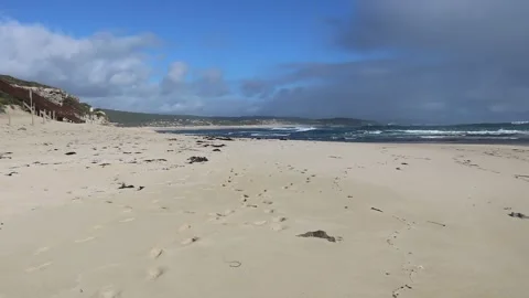 Dark Clouds Over Surfers Point in Margaret River: Tranquil Beach Scene Stock Footage 329475661