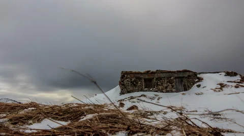 Dark clouds passing by an abandoned stone house, timelapse Stock-Footage 50491105