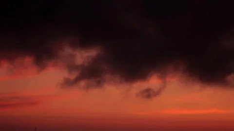 Dark clouds in the red sky at sunset. Stockbeeldmateriaal 51736325