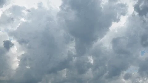 Dark clouds roll in signaling a change in weather as strong winds begin to whip  Stock Footage 315002444