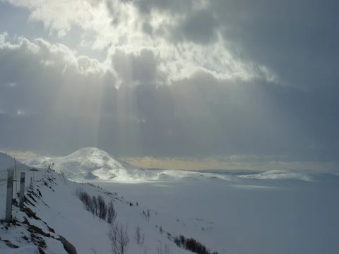 Dark clouds rolling over the snow covered landscape 库存影片 73280465