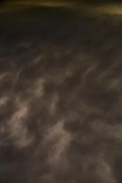 Dark clouds in the sky cover the light top view, dramatic stormy sky in dark  Stock Photos