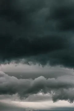 Dark clouds in the sky during a storm. The clouds are ominous and forebodin.. Stock Photos