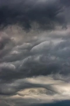 Dark clouds in the sky during a storm. The clouds are ominous and forebodin.. Stock Photos