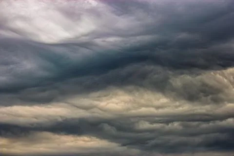 Dark clouds in the sky during a storm. The clouds are ominous and forebodin.. Stock Photos