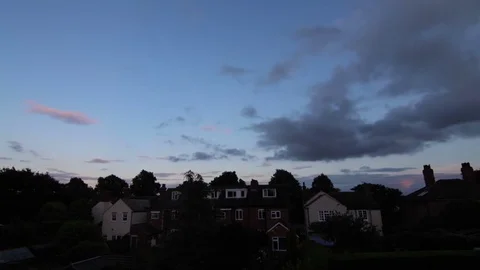 Dark Clouds in Sky Timelapse Light Fades Above Rooftops 動画素材 72840833
