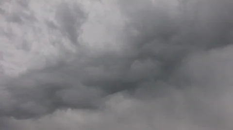 Dark clouds slowly drift in the gloomy sky (High Definition) Stock Footage 69065