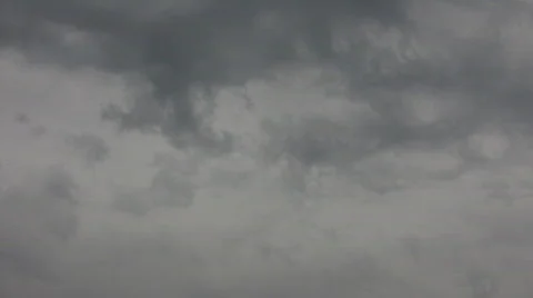 Dark clouds slowly drift in the gloomy sky (High Definition) Stock Footage 69074
