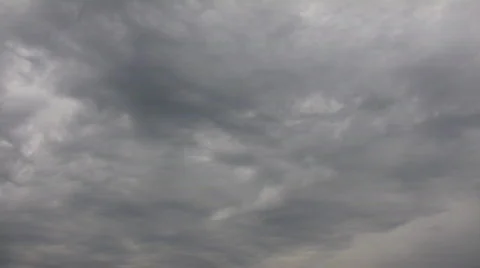 Dark clouds slowly drift in the gloomy sky (High Definition) Stock Footage 69079