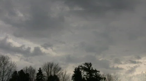 Dark clouds slowly drift in the gloomy sky (High Definition) Stock Footage 69081