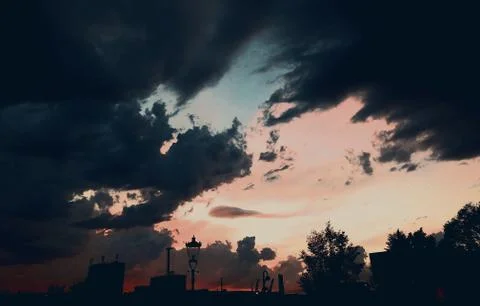 Dark clouds with storm at sunset in amsterdam Stock Photos