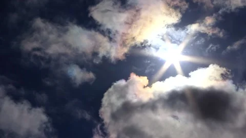 Dark clouds, sun star, blue sky - time lapse cloudscape - sky background Stock Footage 153526823