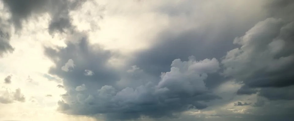 Dark clouds at sunset in winter Stock Photos