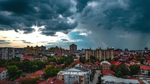 Dark clouds with a sunshine on the side above city Stock Footage 249287926