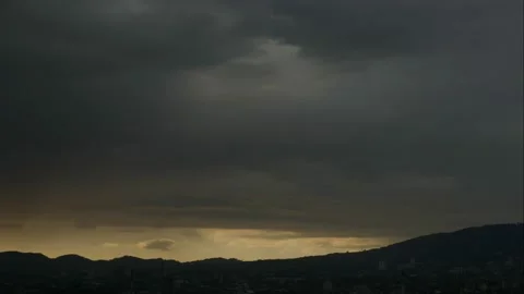 Dark clouds timelapse, mega storm over the city Stock Footage 135347843