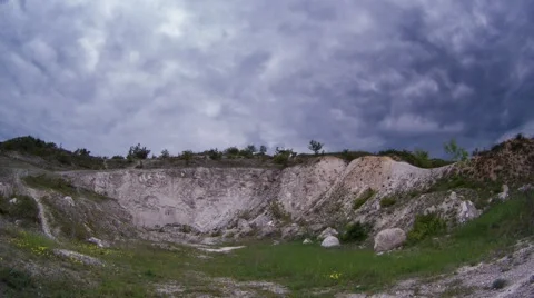 Dark clouds timelapse over the industrial chalkpit hills Stock Footage 63110150
