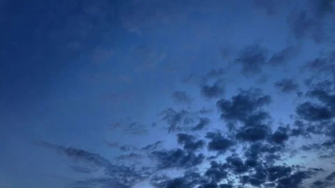 Dark clouds transition to a lighter sky in a dramatic timelapse Stock Footage 299087425