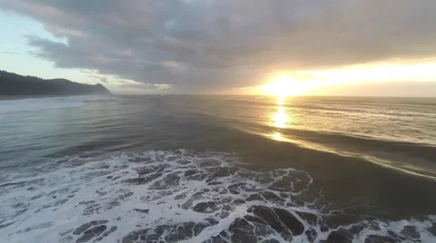 Dark Clouds, Waves, and Golden Sun Stock Footage 51888239