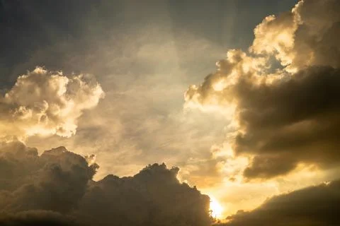 Dark clouds which sunshine in the evening. Stock Photos