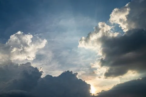 Dark clouds which sunshine in the evening. Stock Photos