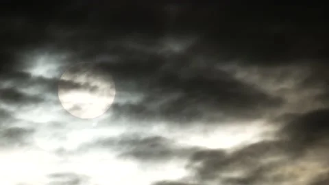 Dark clouds, white sun, golden sunlight at sunrise - sky background - Time Lapse Stock Footage 154748416