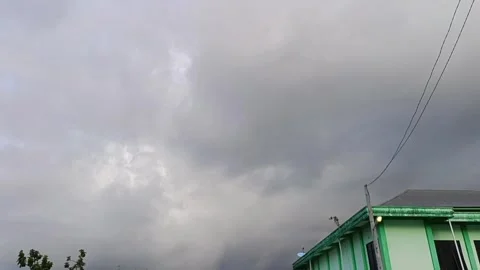 Dark cloudy sky above a philippines building, ideal for graphic design projects, Video stock 335065187