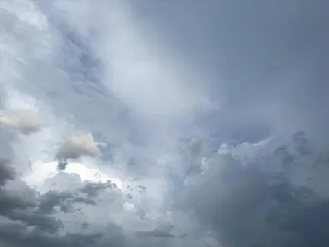 Dark cloudy sky with storm clouds on a gloomy day Stock Photos