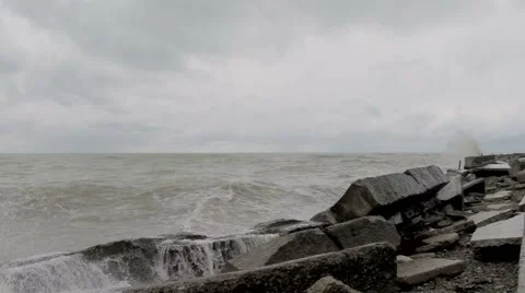 Dark cloudy stormy sky with clouds and waves in the sea - global warming concept 스톡 동영상 48945961
