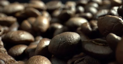 Dark Coffee Beans. Close-up dolly shot. Concept premium coffee bean for process Stock Footage 142983998