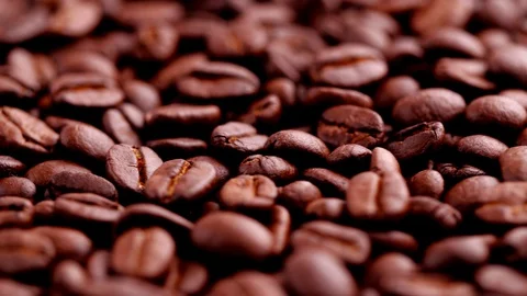 Dark coffee beans rotating. Close-up of seeds of coffee. Stock-Footage 128160865