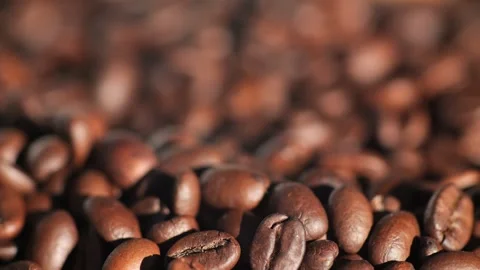 Dark coffee beans. Rotation. Coffee beans. Close up of coffee seeds. Beautiful Stock Footage 267053839