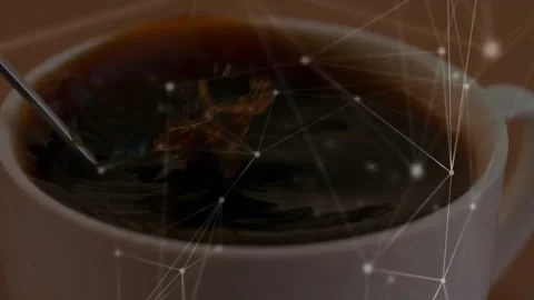 Dark coffee being stirred in ceramic cup by spoon, with glowing nodes and lines Stock Footage 307445420