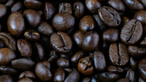 Dark Coffee Grains. Coffee beans rotating. Close up of seeds of coffee. Stock Footage 124678692