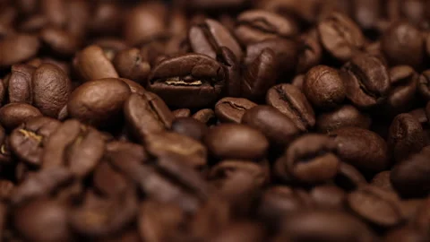 Dark Coffee Grains. Coffee beans falling in slow motion. Close-up  Stock Footage 260409612