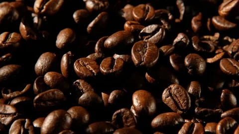 Dark Coffee Grains. Macro of coffee beans rotating. Close up of seeds of coffee. Stock Footage 125603010
