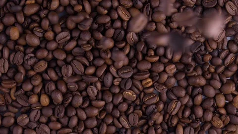 Dark Coffee Grains. Rotating and falling. Coffee beans. Stock Footage 122187339