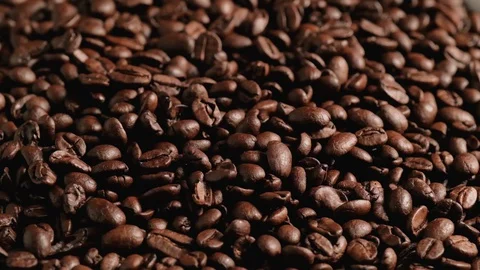 Dark Coffee Grains. Rotating and falling. Stock Footage 129506607