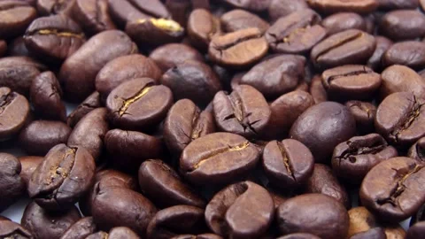 Dark Coffee Grains. Rotating and falling. Coffee beans.  動画素材 159237172