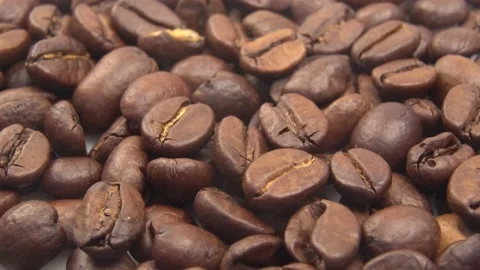 Dark Coffee Grains. Rotating and falling. Coffee beans. Close up of seeds of cof Stock Footage 159678199