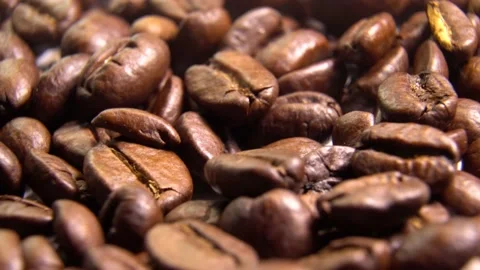 Dark Coffee Grains. Rotating and falling. Coffee beans. Close up of seeds of cof Stock Footage 163997307