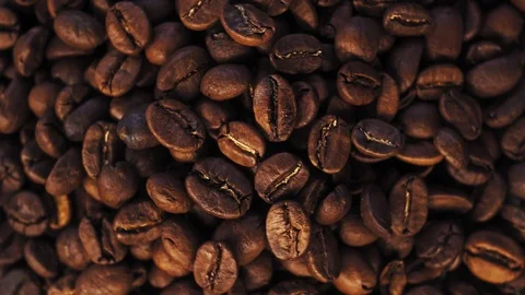 Dark Coffee Grains rotating. Coffee beans. Close up of seeds of coffee Stock Footage 121495991