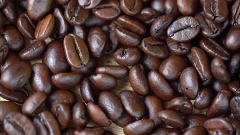 Dark Coffee Grains. Rotating. Coffee beans. Close up of seeds of coffee Video stock 134957992