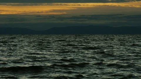 Dark cold waves of Lake Baikal after sunset. Stock Footage 294626470