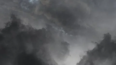 Dark colonimus clouds and thunderstorms crashing 4k Stock Footage 255012070