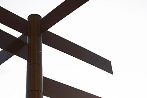 Dark coloured multidirectional signpost with blank spaces for text Stock Photos