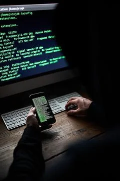 Dark, computer and hacker phone with coding for password info, malware or Foto stock